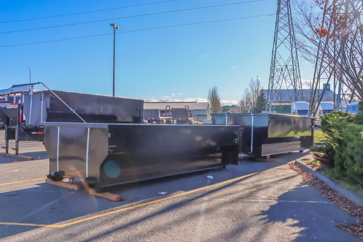 Roll-off dumpster ready for waste disposal at job site for 2 Yard Dumpster Rental in Savannah